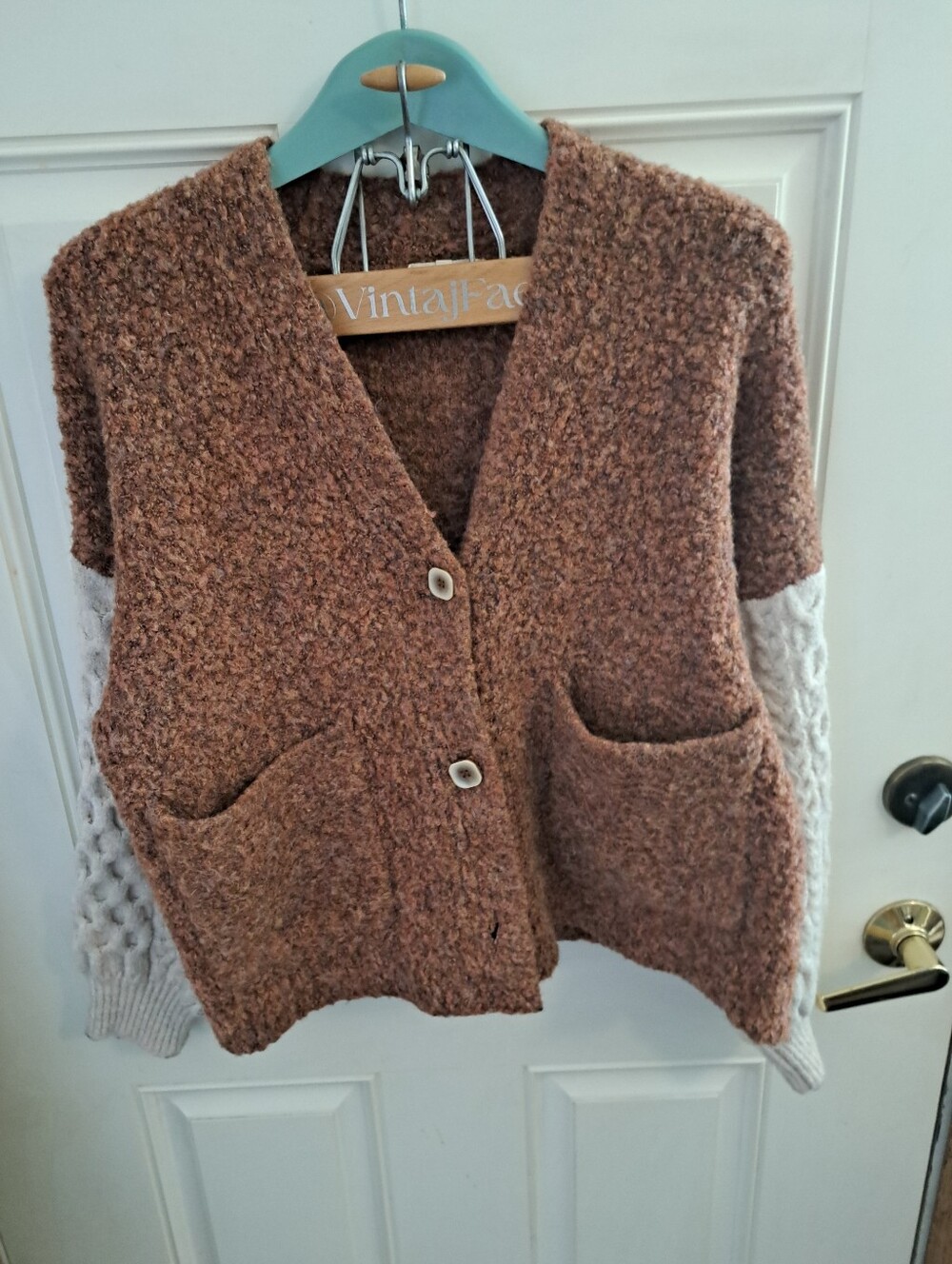 GILDED INTENT Cozy Brown Bouclé Sweater with Cream Cable-Knit Sleeves